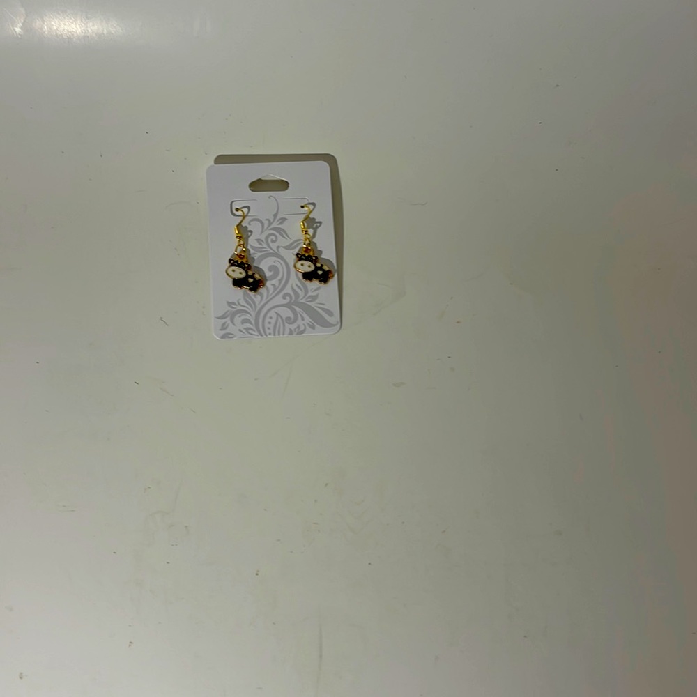 All black handmade cow earrings